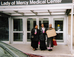 Taking gifts to the cancer patients on the oncology unit at Our Lady of Mercy Medical Center on 'Make a Difference Day'. From Left to Right, Norma Boyd - Assistant Director of the 'Look Good, Feel Better' Program, Donna Peterson - Secretary and Director of the 'Look Good, Feel Better' Program, and Angela Darling - Founder and President of Love Your Breast, Inc.